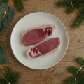 Back bacon on a cream plate in a festive farmhouse setting